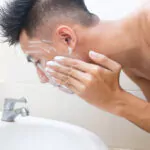 a man washing his face
