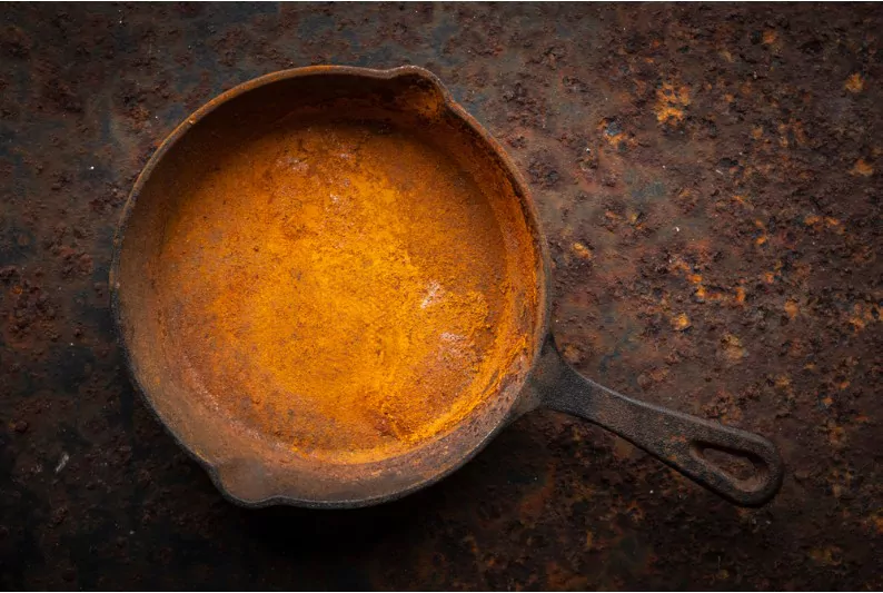 a rusty cast iron pan