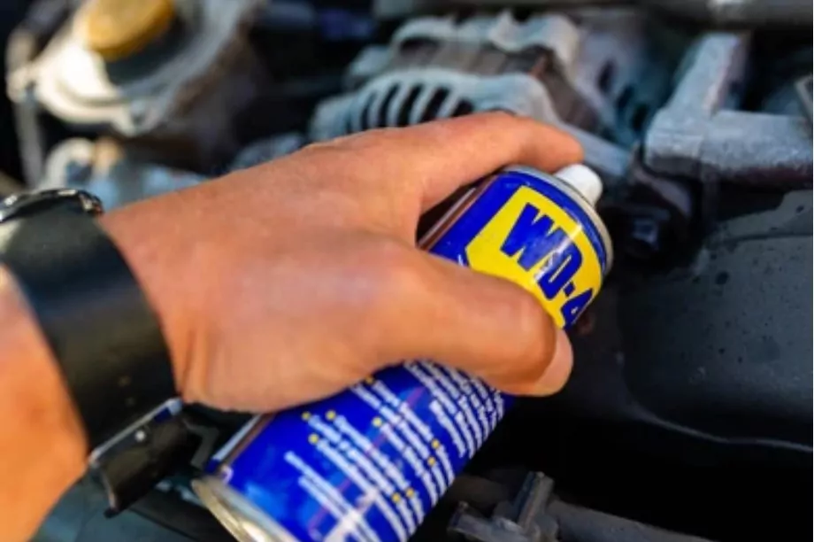 spraying wd40 on car exhaust