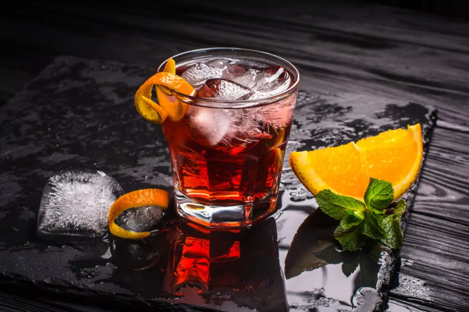 a glass of gin negroni