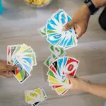 group of friends playing uno cards