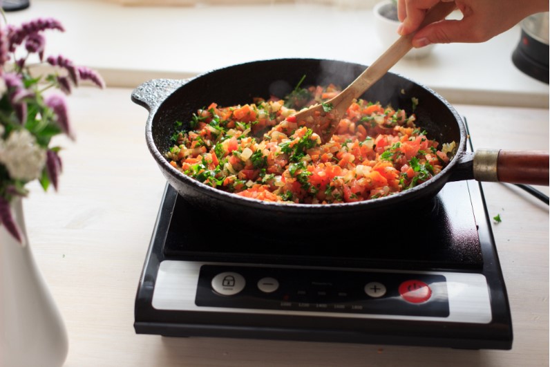 cooking the food on induction stove