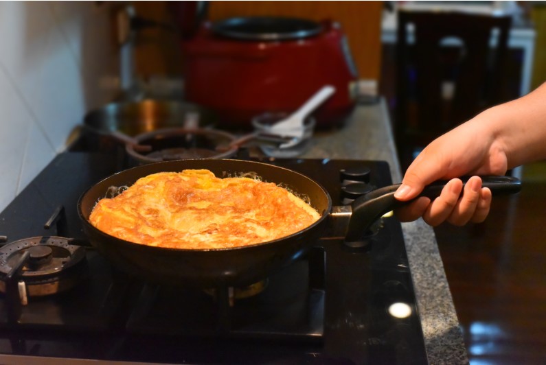 egg cake being cooked on stove top