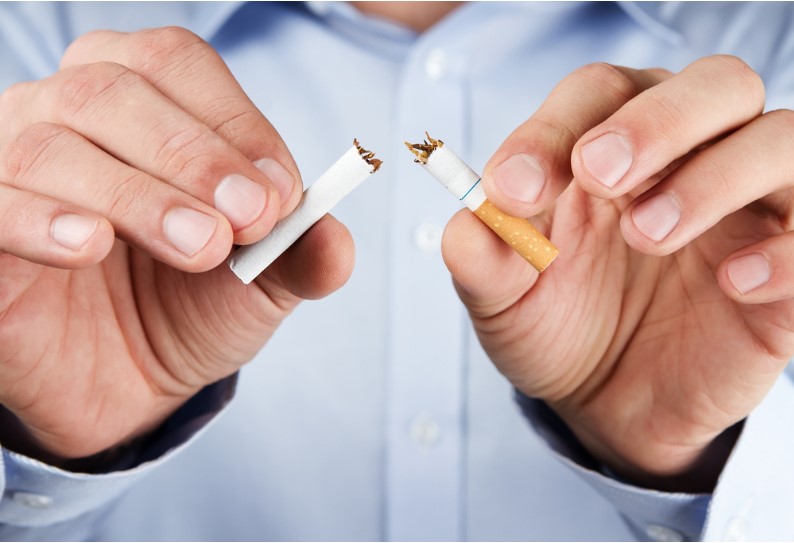 a portrait of human hands indicating quit smoking