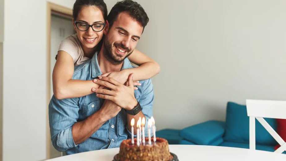 wife surprise his husband with birthday cake