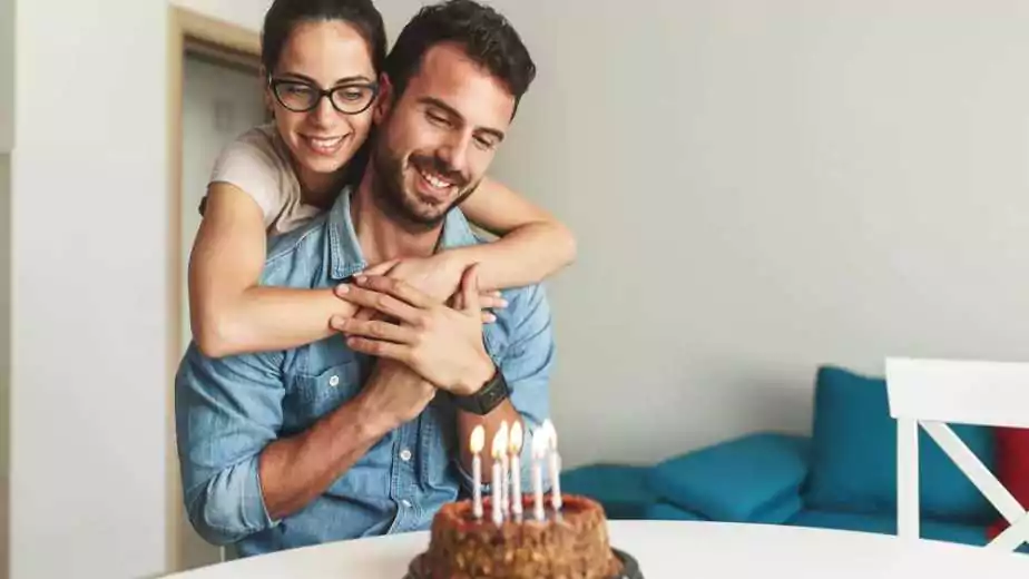 wife surprise his husband with birthday cake