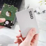 man holding an ssd in his hands