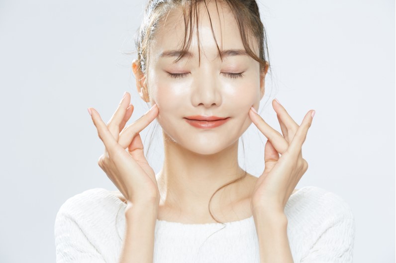glowing face of a korean girl after toning the face
