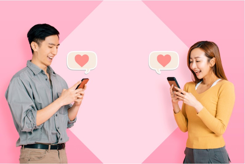 young happy couple using mobile app to connect and instant messaging