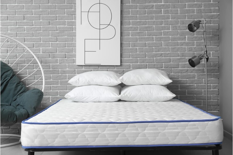A soft orthopedic euro top mattress on the bed in the room