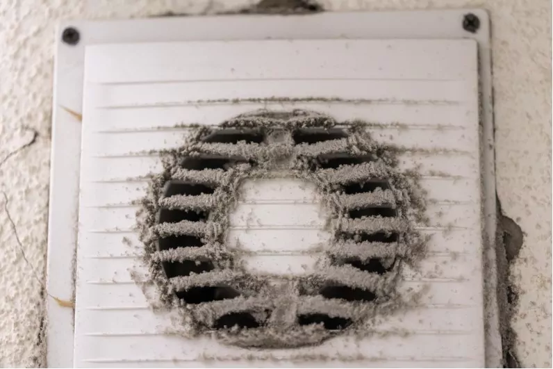 dirty and dusty white plastic air filter in a kitchen exhaust