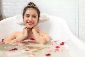a smiling and happy woman enjoying shower