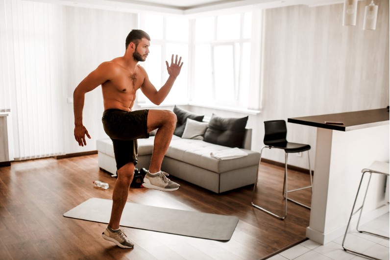 young man doing exercising at home