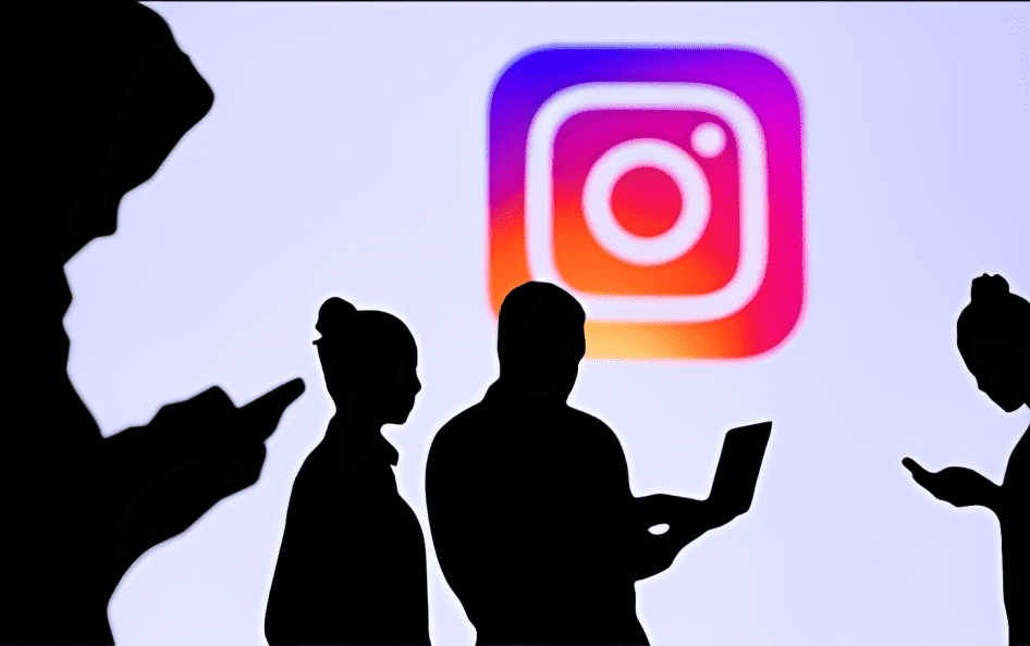 group of people using instagram with instagram logo in background