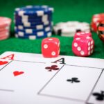 chips placed on a green table as a symbol of the coin used to bet on a casino