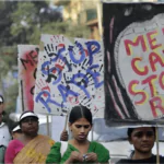 indian women holding signs and banners during a rally to remember the gang raped victim nirbhaya from new delhi in the year 2012
