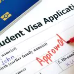 pen voting approved in the checkbox in blank student visa application form with passport and pen