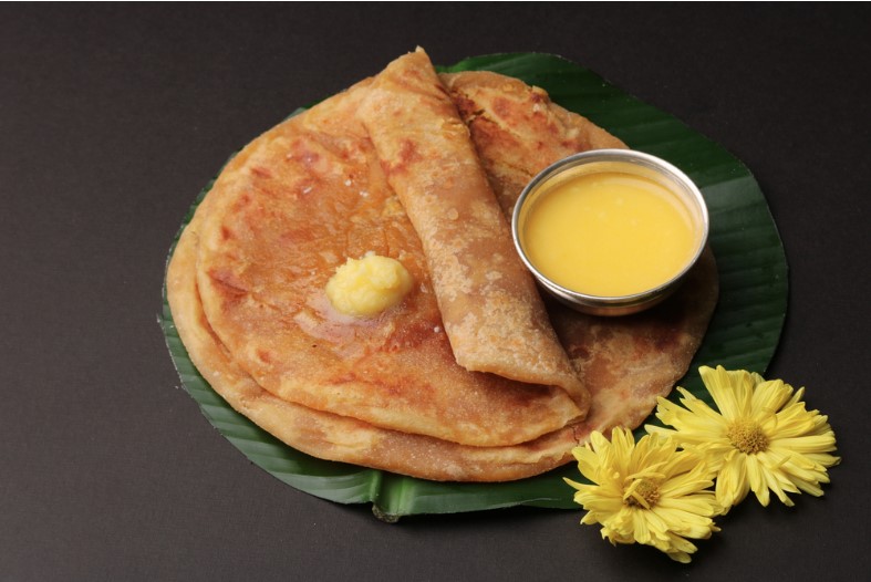 puran poli served on banana leaf with pure ghee