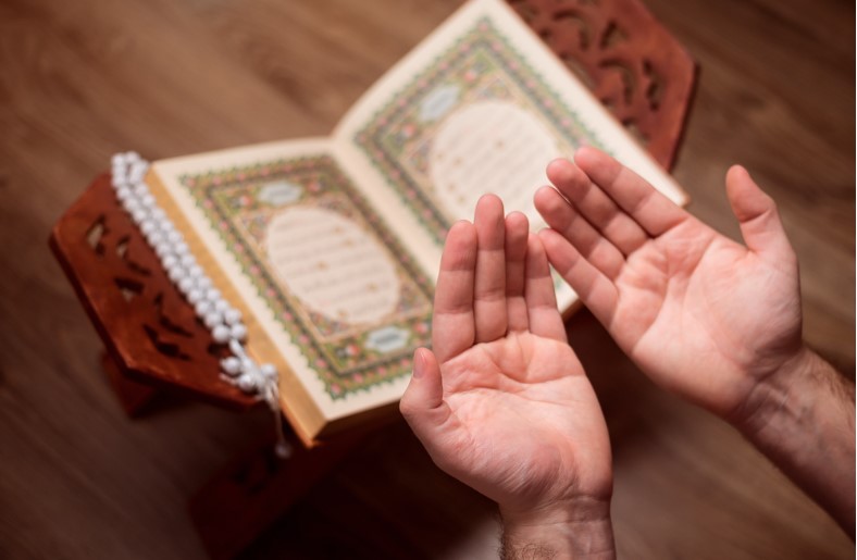 a man makes a prayer after reading the holy quran