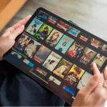 woman using netflix application streaming movies and tv series