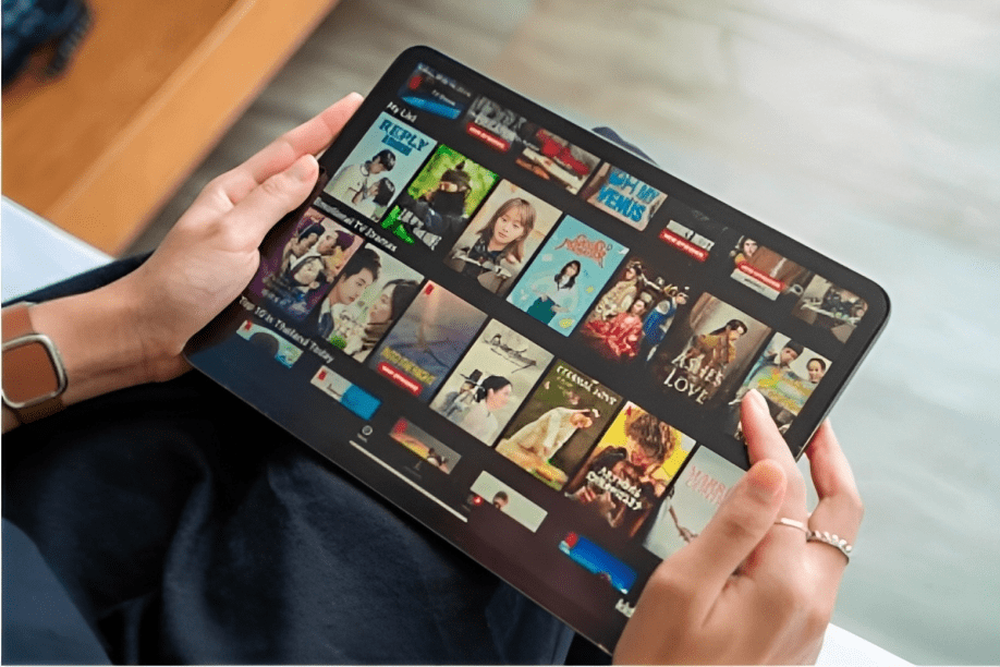 woman using netflix application streaming movies and tv series