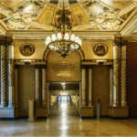 the lobby of the hotel is decorated with frescos and murals massive wood-beamed ceilings