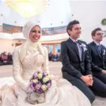 smiling islamic bride and groom marrying at a mosque