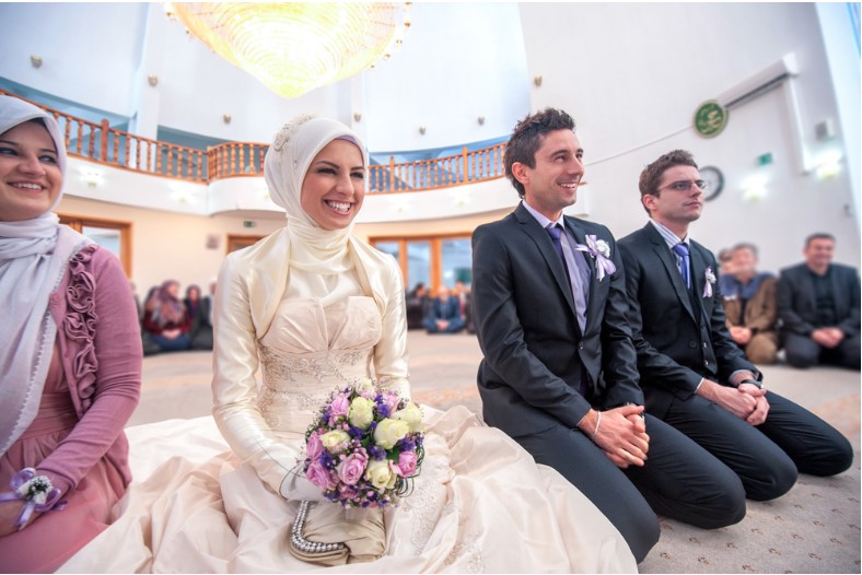 smiling islamic bride and groom marrying at a mosque