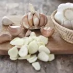 sliced garlic garlic clove garlic bulb in wicker basket