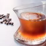 ice nespresso tonic with coffee beans in a glass
