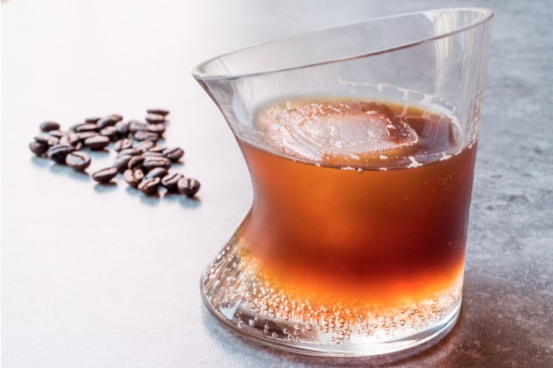 ice nespresso tonic with coffee beans in a glass