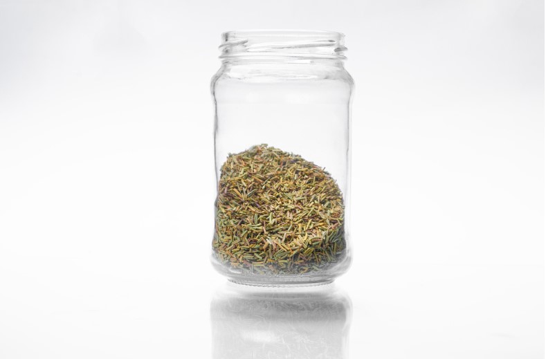 dried rosemary in a glass jar