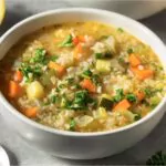 homemade healthy lemon rice soup with carrots and celery