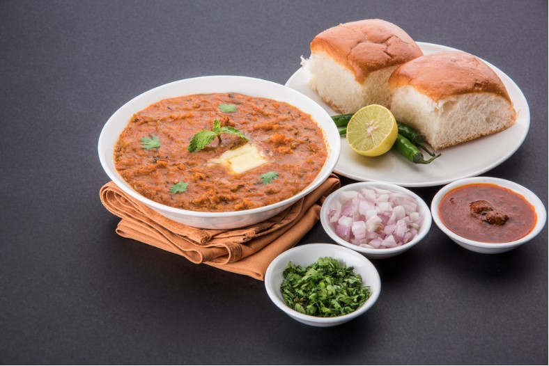 pav bhaji served with pav with onion and chutney