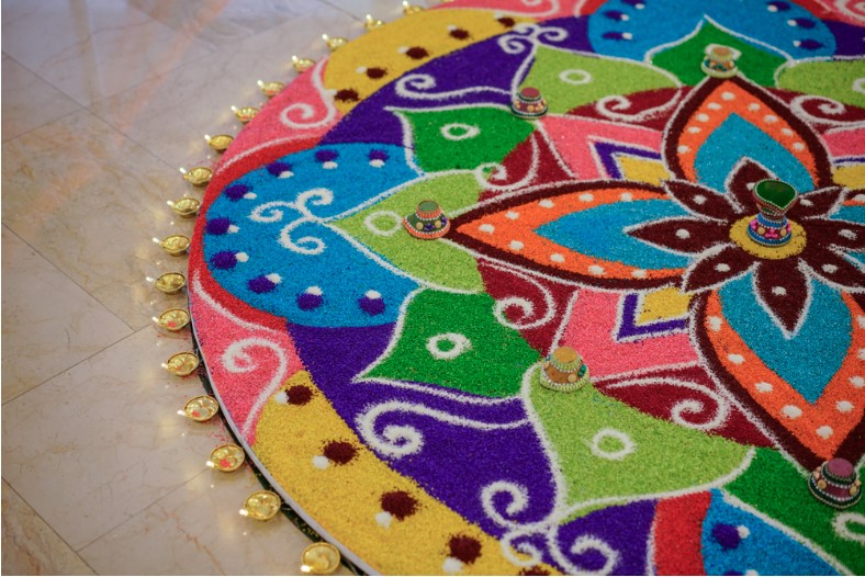 preparation for diwali celebration with rangoli