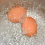eggs boiling in a kettle