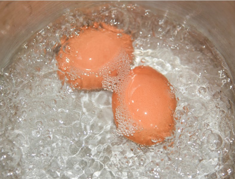 eggs boiling in a kettle