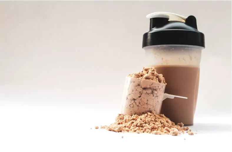 whey protein supplement with shaker for mixing