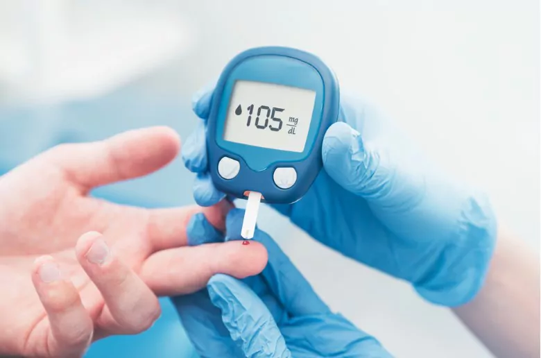 doctor checking blood sugar level with glucometer treatment of diabetes concept