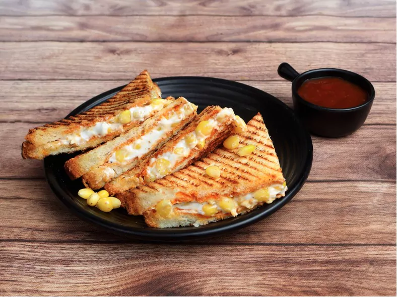 sweet corn cheese grilled sandwich served with ketchup
