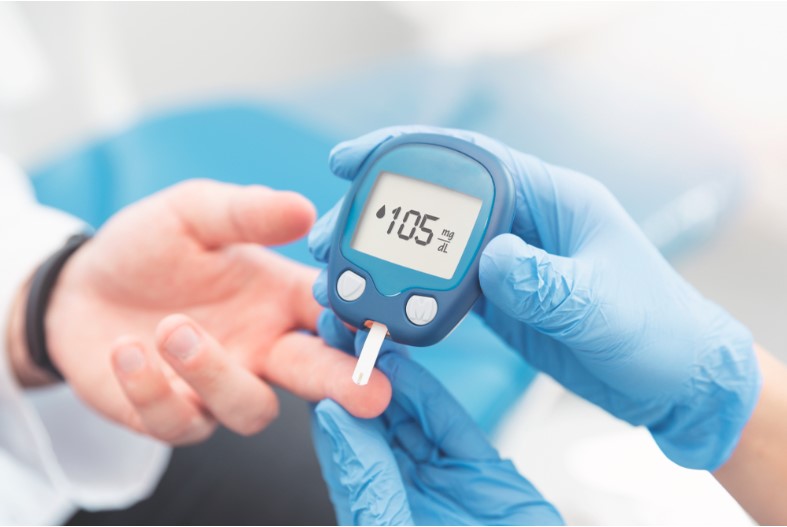 doctor checking blood sugar level with glucometer treatment of diabetes concept