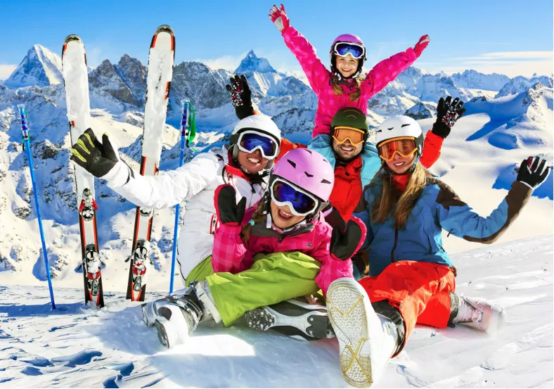skiing family enjoying winter vacation on snow in sunny cold day in mountains and fun switzerland
