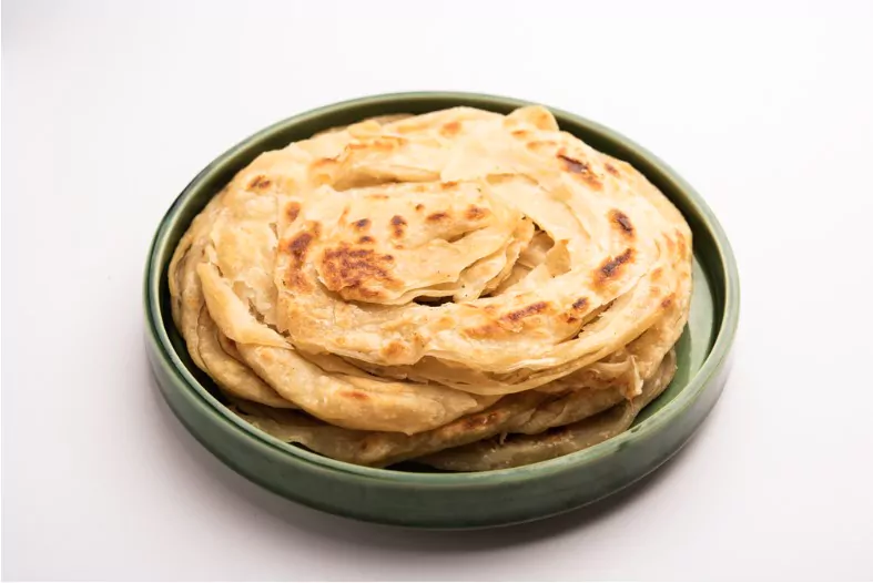 laccha paratha is a layered puffed flatbread with lots of ghee or oil