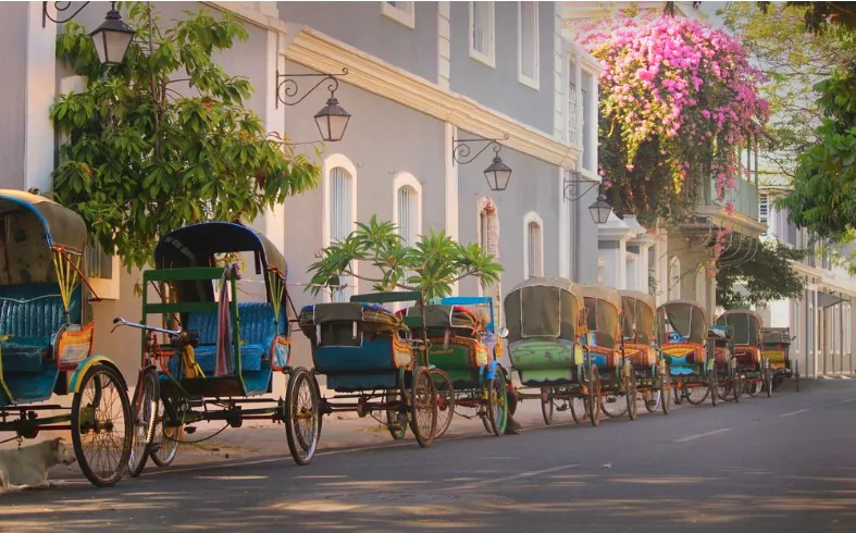 vintage tricycle carts on french style street at pondicherry