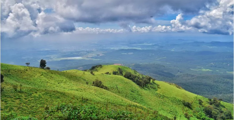green hills at coorg india with a beautiful view of the lowlands