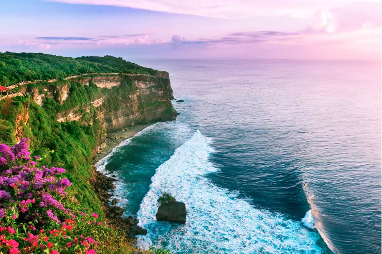view of uluwatu cliff with pavilion and blue sea in bali indonesia