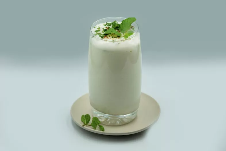 a spiced yogurt based drink buttermilk in a glass