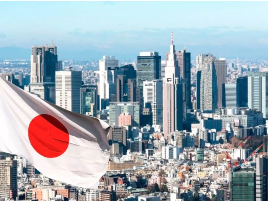 panoramic view of tokyo and japanese flag