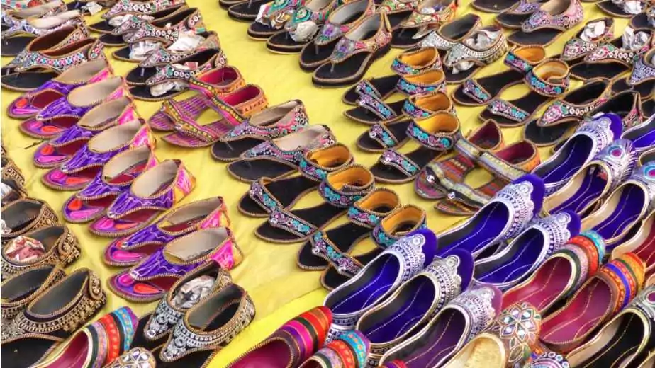 display of traditional shoes at the street market in jaipur