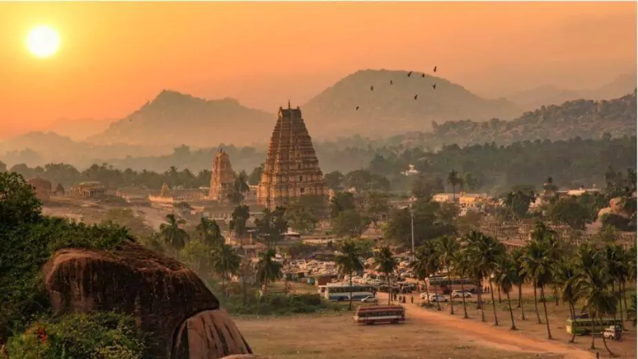 historic virupaksha temple with scenic hampi landscape and cityscape at sunset at karnataka india